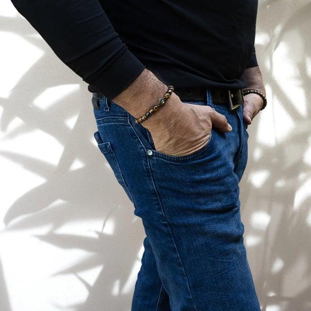The Lion Tiger Eye Men Beaded Bracelet is a unique and stylish piece of jewelry that showcases the power and strength of...
