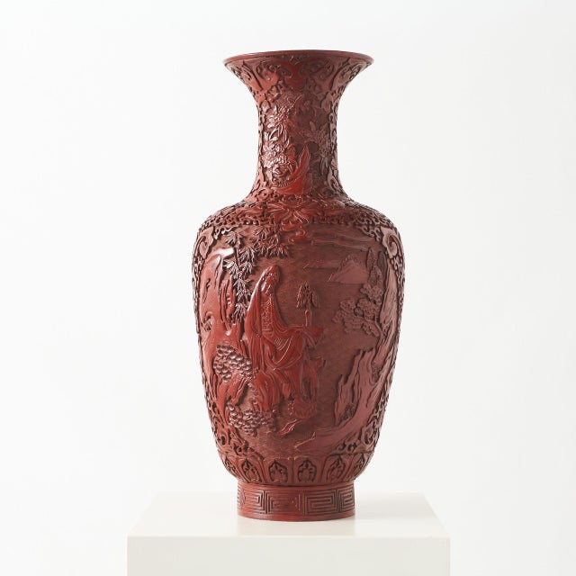 Carved Cinnabar Lacquer Vase Chinese cinnabar lacquer vase finely carved with a garden scene featuring a seated robed...