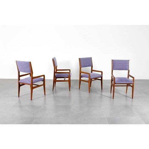 Beautiful set of 4 chairs mod."111" by Giò Ponti, with a shaped wooden structure, with padded back and seat and covered in...