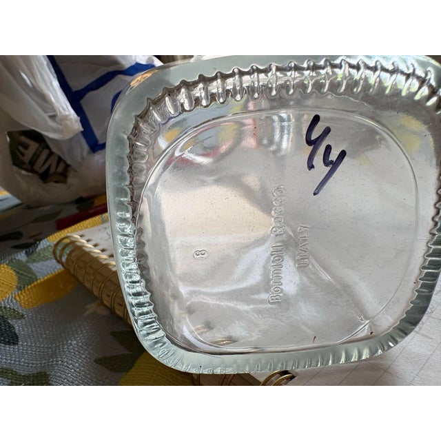Square bodied clear glass pitcher. Thick pressed glass walls. Textured ridged base. Wide comfortable handle. Modern...