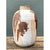 This vintage abstract stoneware vase presents a robust, hand-thrown silhouette, its cylindrical body gently tapering from...