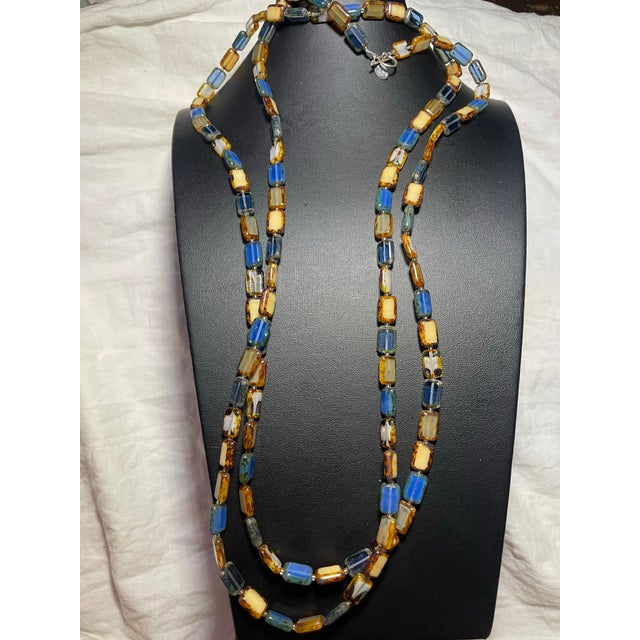 Stefanie Wolf, 60” artisan strand features her signature "Picasso" finish rectangular glass tile beads strung in a...