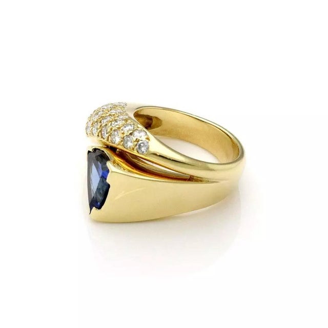 This is a gorgeous cocktail ring, it is crafted from 18k yellow gold with a high polished finish. The front of the ring...