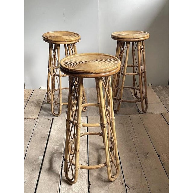Its character comes from the tall, airy structure and the naturally flowing lines of the rattan. Four slender legs flare...