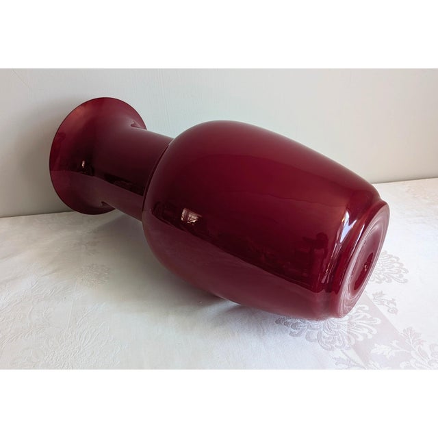 One of two currently available on Chairish. Stunning early 2000's era large deep red Murano vase signed by the De Majo...