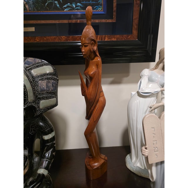 Overview A commanding, museum-grade Mid-Century Balinese modernist figurative sculpture standing at an imposing 21 inches....
