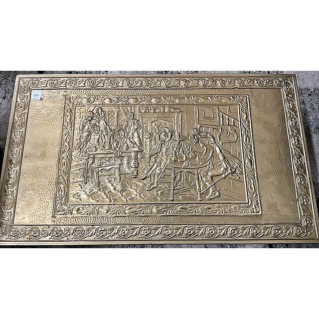 Mid century vintage hand hammered embossing brass fireplace box, featuring detailed repoussé tavern pub scenes. Likely...