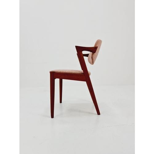Mid Century Danish dining chair by Kai Kristiansen for Schou Andersen Model 42 - 1960s, The chair frames are made from...