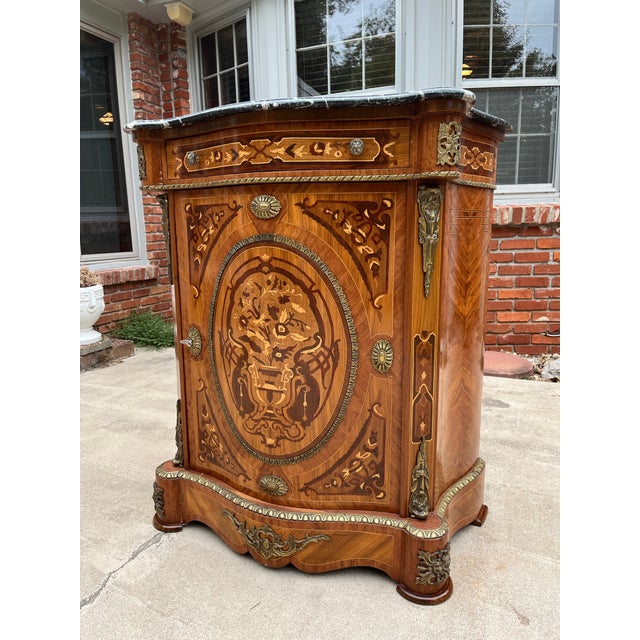 Early French Louis XV style console cabinet. Craftsmanship is indicative of late 1800s-early 1900s construction and is...