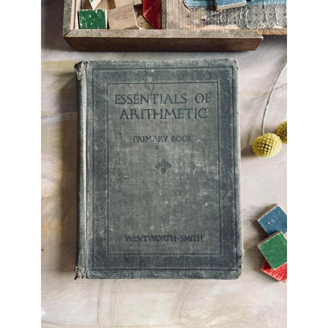 pair of primitive schoolbooks from the early 1900s, one book for english and the other for arithmetic. lovely to display...