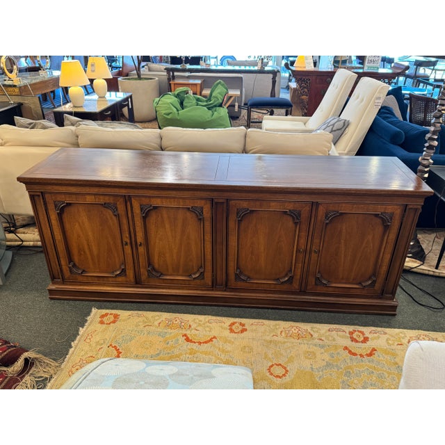 Design Plus Gallery presents a Sideboard from White Fine Furniture. The sideboard is made of walnut wood with a honey...