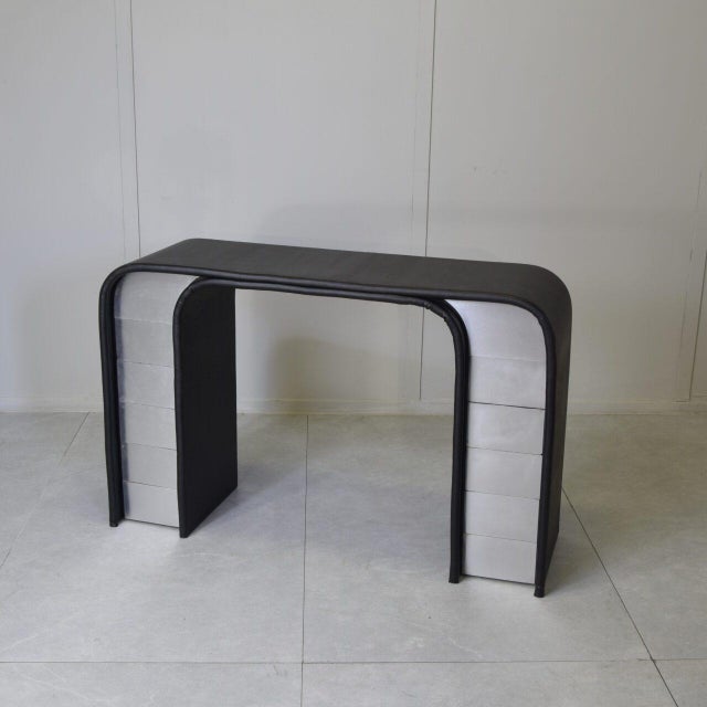 This console table is a tangible example of the bold and elegant design of the Italian postmodern period, blending...