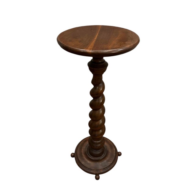 A lovely, antique, barley twist pedestal / plant stand in a walnut finish. Features a tapered, carved barley twist column...