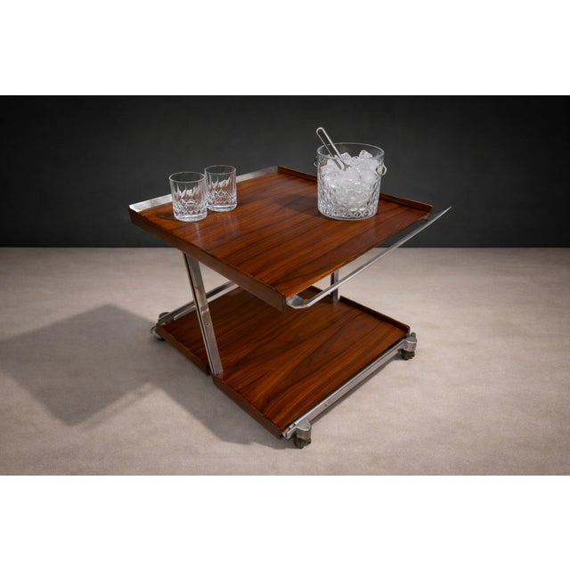 Attributed to Forma, Brazil, this bar cart from the 1960s reflects the studio’s refined balance of industrial precision...