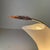 Really rare and spectacular table or desk lamp shaped as an asymmetrical cornucopia or wave, this model is made of white...