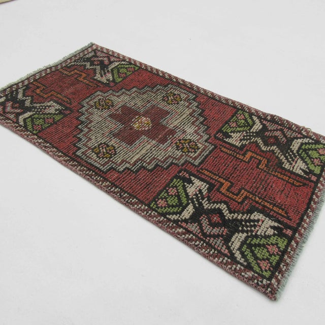 Vintage handknotted decorative mini rug from Konya region of Turkey. Approximately 50-60 years old. In very good condition.
