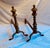 Well turned Edwardian Brass fireplace andirons with iron back stands into fireplace.