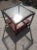 This is a nice boho chic end table by Ficks Reed. It's designed by John Wisner. It has a lower bottom drawer that also...