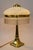 Art Nouveau table lamp Vienna around 1910s. Brass polished and stove enamelled. Opal glass shade. Glass sticks are...