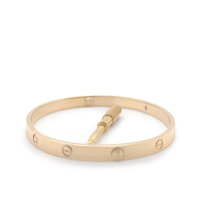 This iconic Cartier Love bracelet is crafted in 18ct yellow gold and set with four brilliant-cut diamonds totalling 0.42...