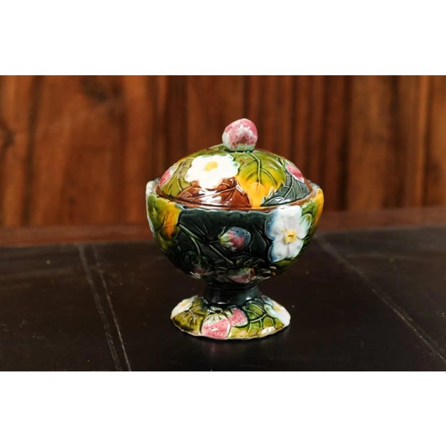 A French majolica lidded bowl from the 19th century, with strawberry motif, white flowers and foliage. Created in France...