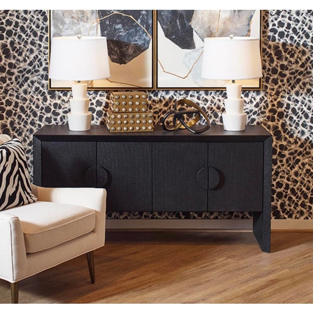 New item. Not vintage. The Colt black four-door buffet in black painted natural grasscloth with sleek black oak handles....