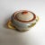 This ceramic bowl with lid features polychrome colors on a white base. It is decorated with landscape decorations on...
