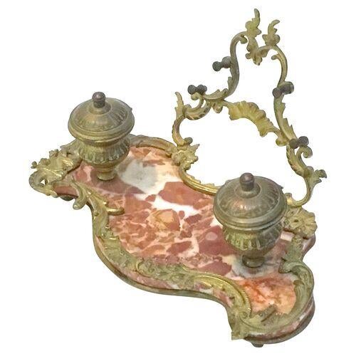 Antique marble-and-brass acanthus encrier with brass acanthus leaf handle. Two brass lidded inkwells. Red marble base and...