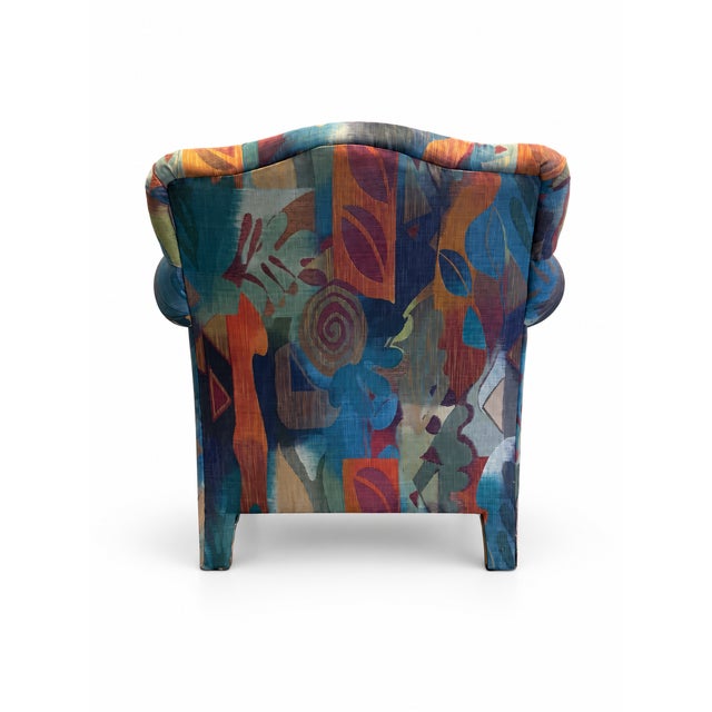bold late-20th-century lounge chair featuring an expressive abstract upholstery pattern and a generously proportioned,...