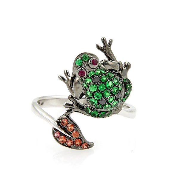 The Frog Leaf Bypass 18k White Gold Tsavorite Sapphire Garnet Ring in size 7 is a stunning piece of fine jewelry that...