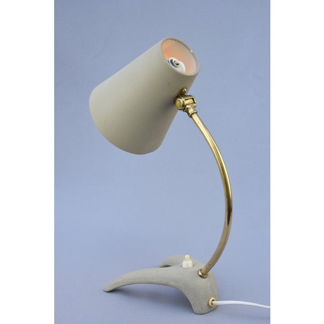A rare model b52 table lamp designed by erik wärnå and produced by ewå värnamo, sweden, during the 1950s. Combining...