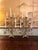 dramatic and highly decorative matched pair of five-light candelabra executed in a French altar-style design. The...