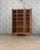 Elegant and commanding, this large art deco wardrobe captivates with its balanced lines, sculpted motifs, and wide beveled...