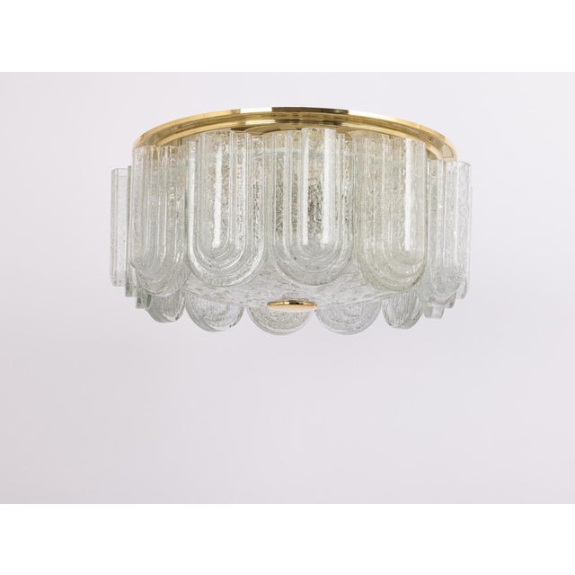 Fantastic mid-century flush mount light by doria, germany, manufactured circa 1960-1969. Several glass cylinders suspended...