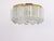 Fantastic mid-century flush mount light by doria, germany, manufactured circa 1960-1969. Several glass cylinders suspended...