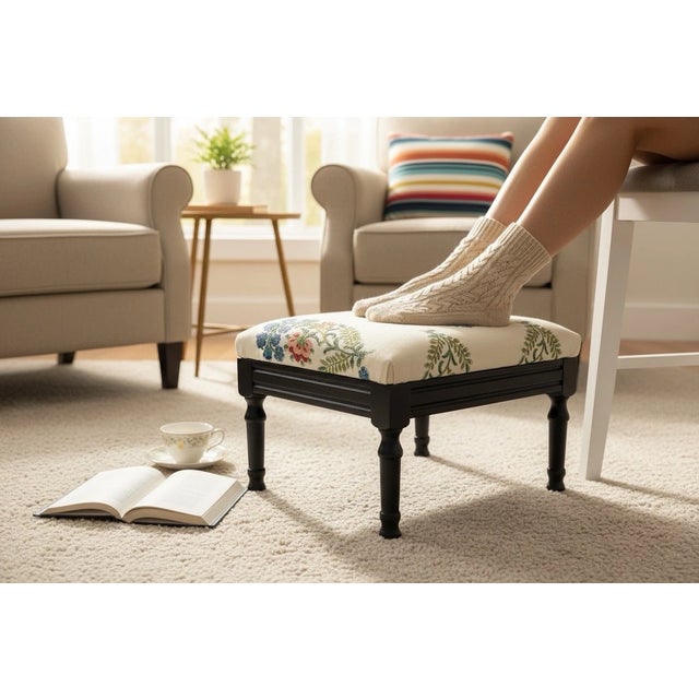 Antique 1920s English Mahogany Footstool featuring elegant turned legs and a beautifully upholstered floral seat. This...