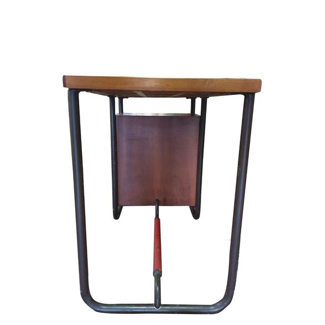 Mid-Century Industrial Desk with Black Metal Frame and Wooden Drawers, 1950s-60s This vintage industrial desk, dating from...