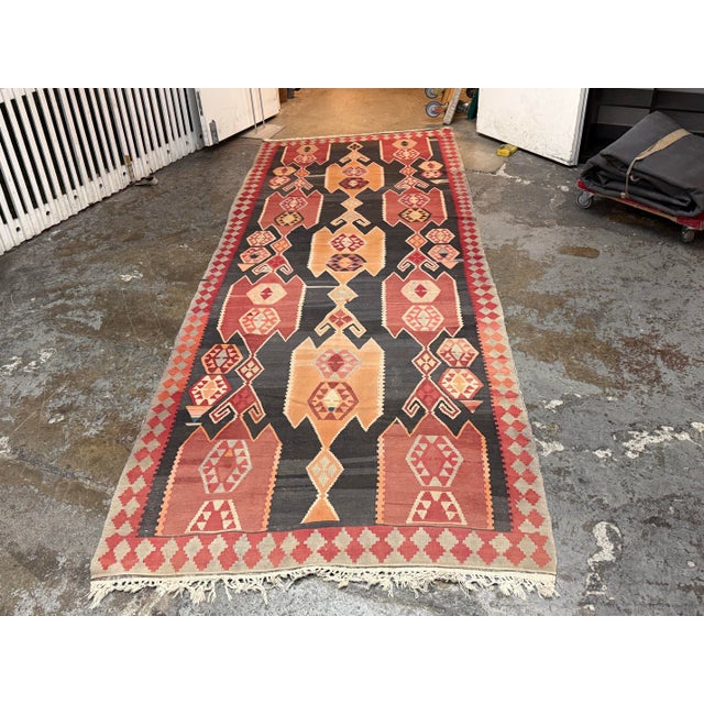 Design Plus Gallery presents a 4ft 8in × 13ft 4in Ft Kilim area Rug from Simonian Rug Cleaners in San Francisco. The rug...