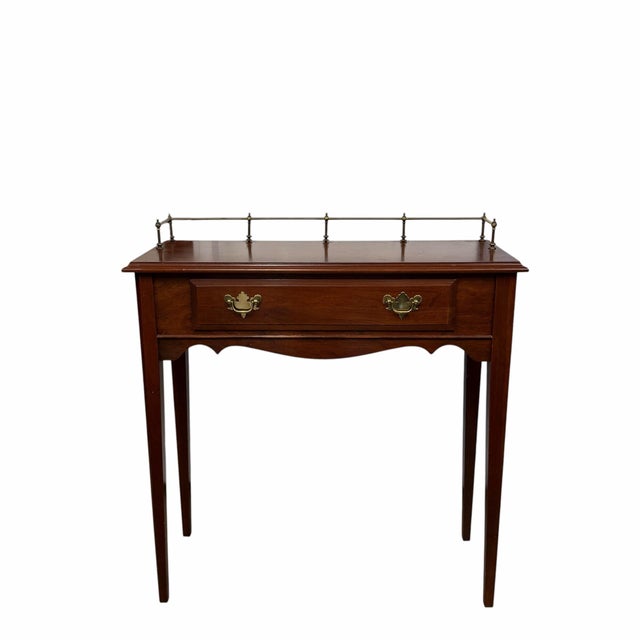 Vintage Hitchcock furniture one drawer writing desk with brass gallery rail. Could be used in almost any room. Sturdy but...