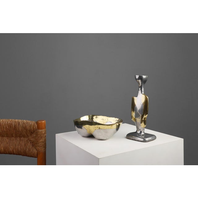 A sculptural pairing of elemental contrast and modernist clarity, this candleholder and bowl. Both designed by David...