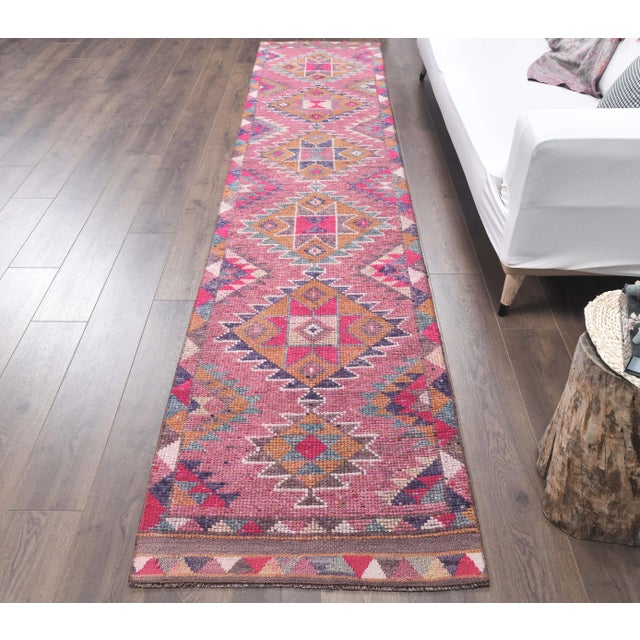 Vintage Turkish Hand-Knotted Tribal Runner Rug is a semi-Vintage rug. '60s Eastern region of Turkey's unique rug is...