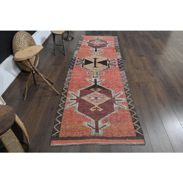 Vintage Turkish Hand-Knotted vintage rug is a semi-antique vintage runner rug. The '70s Eastern region of Turkey's unique...