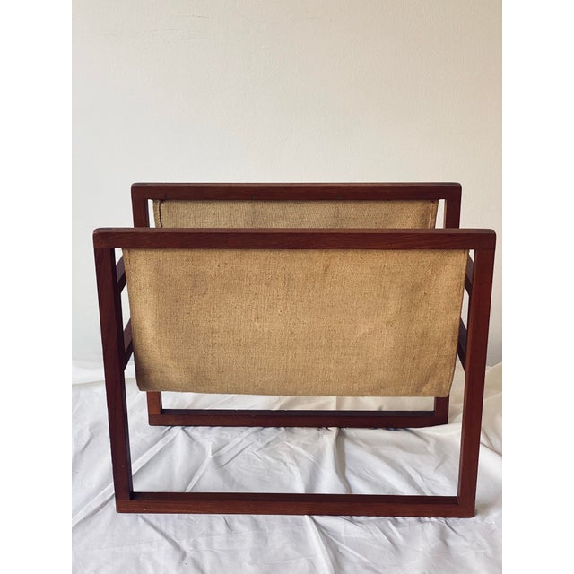 Beautiful Danish mid-century design. Lightweight and exceptionally sturdy construction. Teak wood with an attached linen...