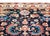 A stunning early 20th century Persian Heriz rug with an all-over mirrored floral pattern with myriad stylized large-scale...