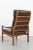 Teak high back easy chair fom Denmark with remarkable twisted armrests. In good vintage condition with normal traces of...