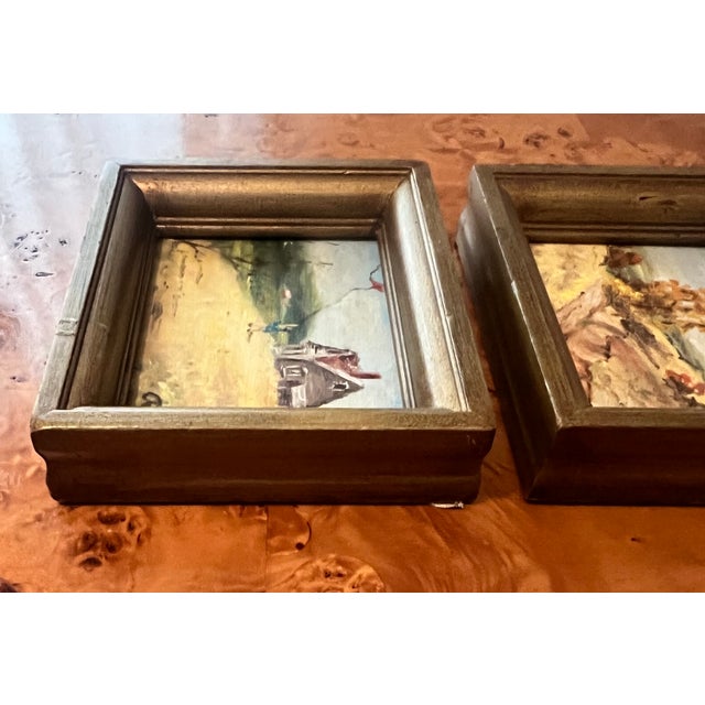 A small expressive oil painting set in matching gilt wood frames with an aged, patina + wear. The first depicts an...