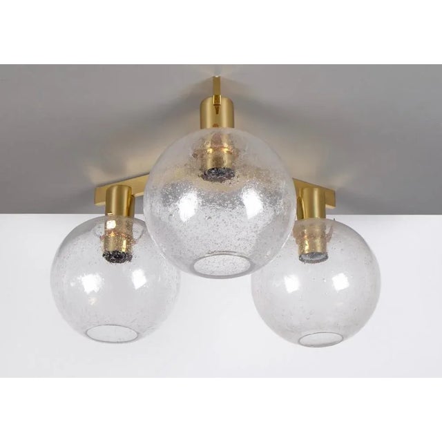 Produced by Hans-Agne Jakobsson AB in Markaryd, Sweden, 1960s. Frame in polished brass. Blown original glass. This piece...