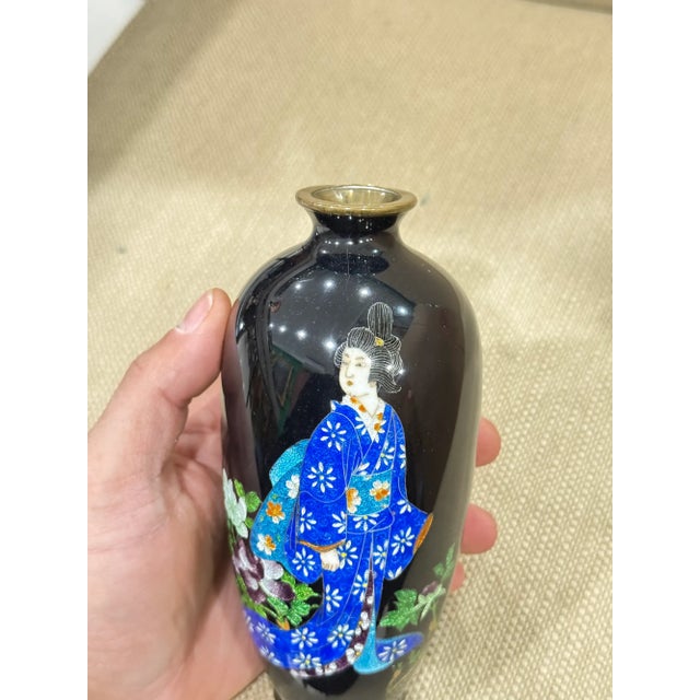 An elegant Japanese cloisonne enamel vase from the Meiji period, circa 1890, featuring a beautifully rendered Japanese...