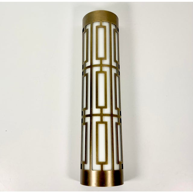This is a striking Wall Mounted Sconce with a toke Bronze colored metal over Milk glass liner. The design is a modified...