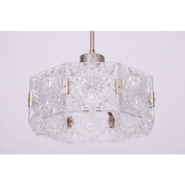 This chandelier is an outstanding example of 1960s czechoslovak design, created by the legendary designer jaroslav bejvl....